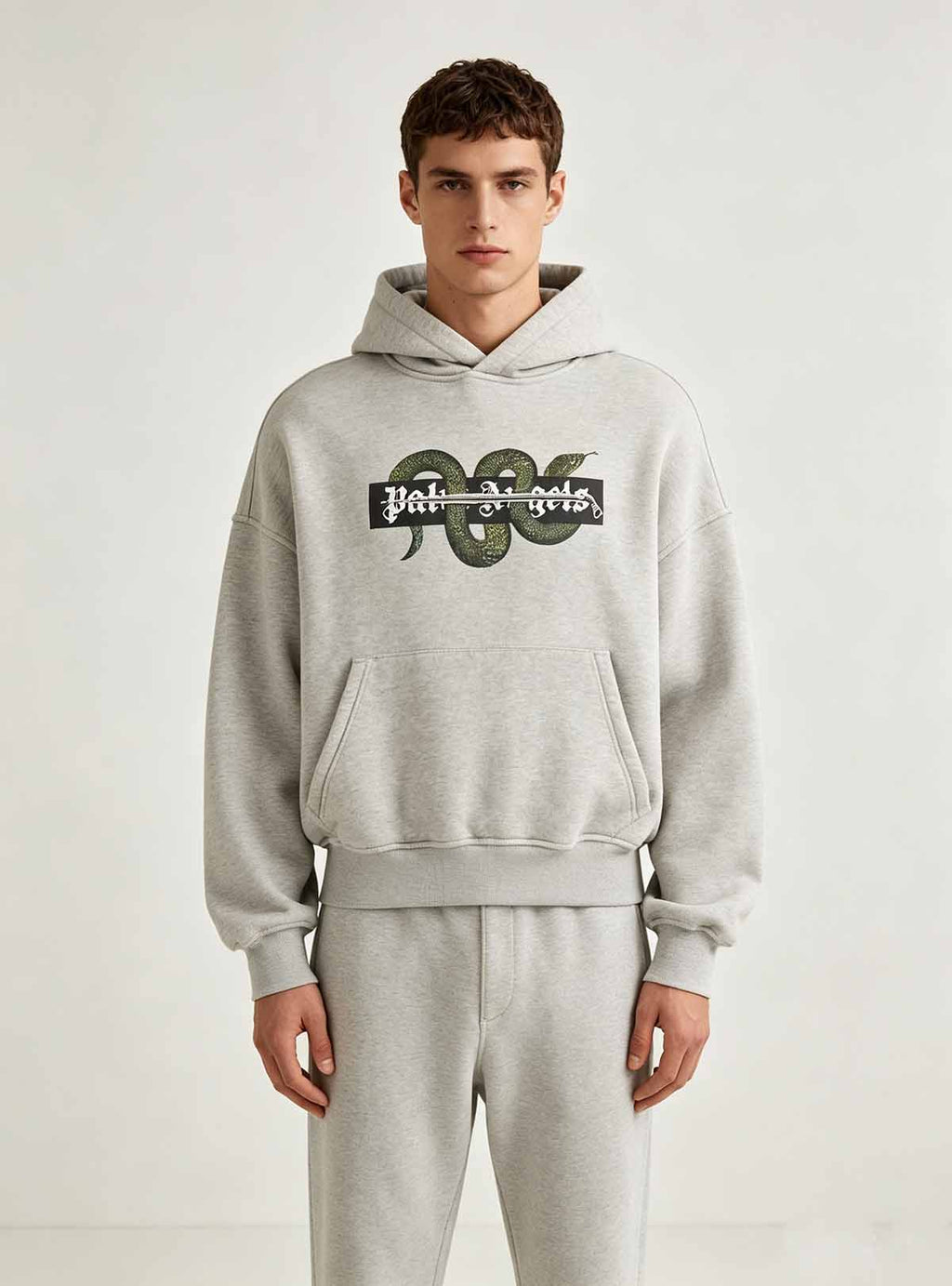  Full front standing pose of grey cropped hoodie on male model, drop shoulder oversized loose fit casual street top for ODM custom fashion brand series