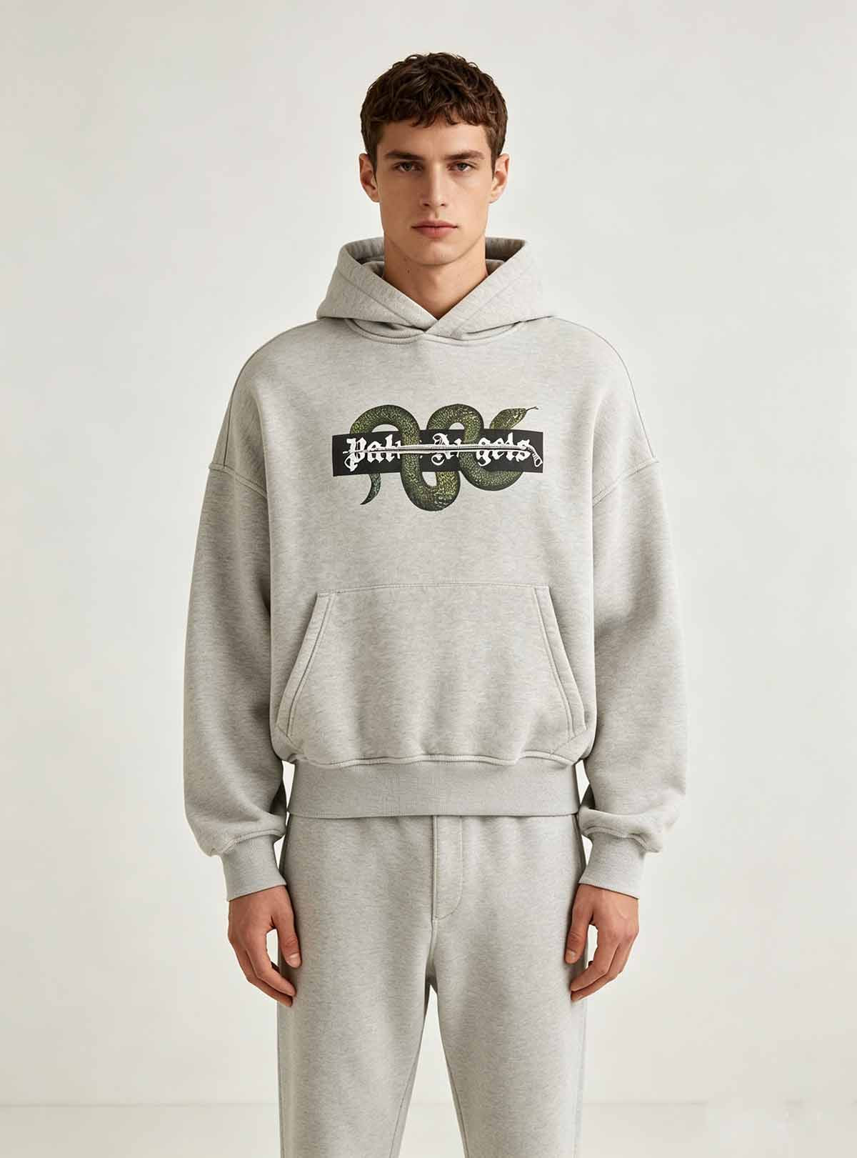  Full front standing pose of grey cropped hoodie on male model, drop shoulder oversized loose fit casual street top for ODM custom fashion brand series