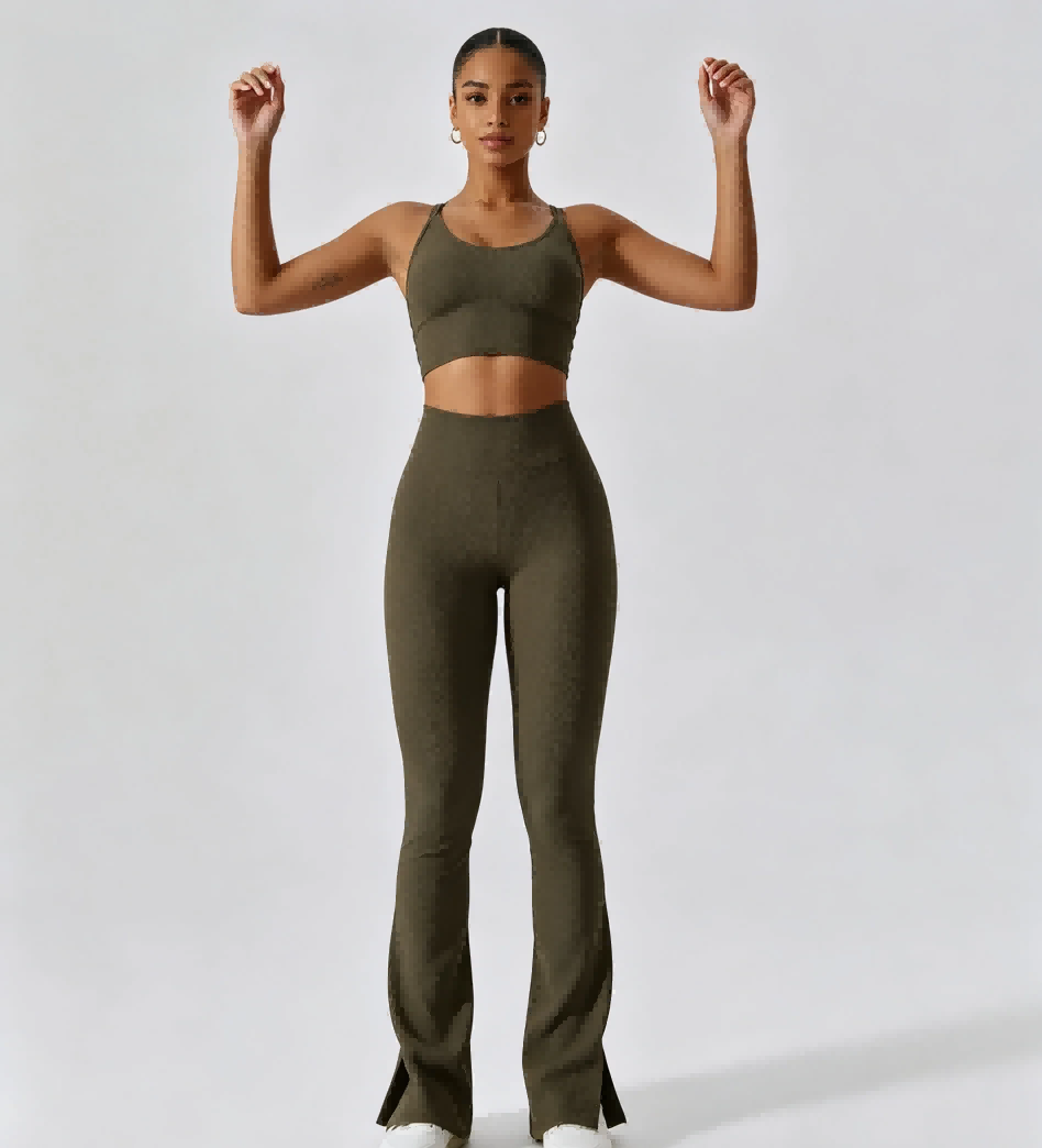 Muscle flex standing pose of ribbed flared fitness suit, adjustable lace open back detail for private label women’s activewear