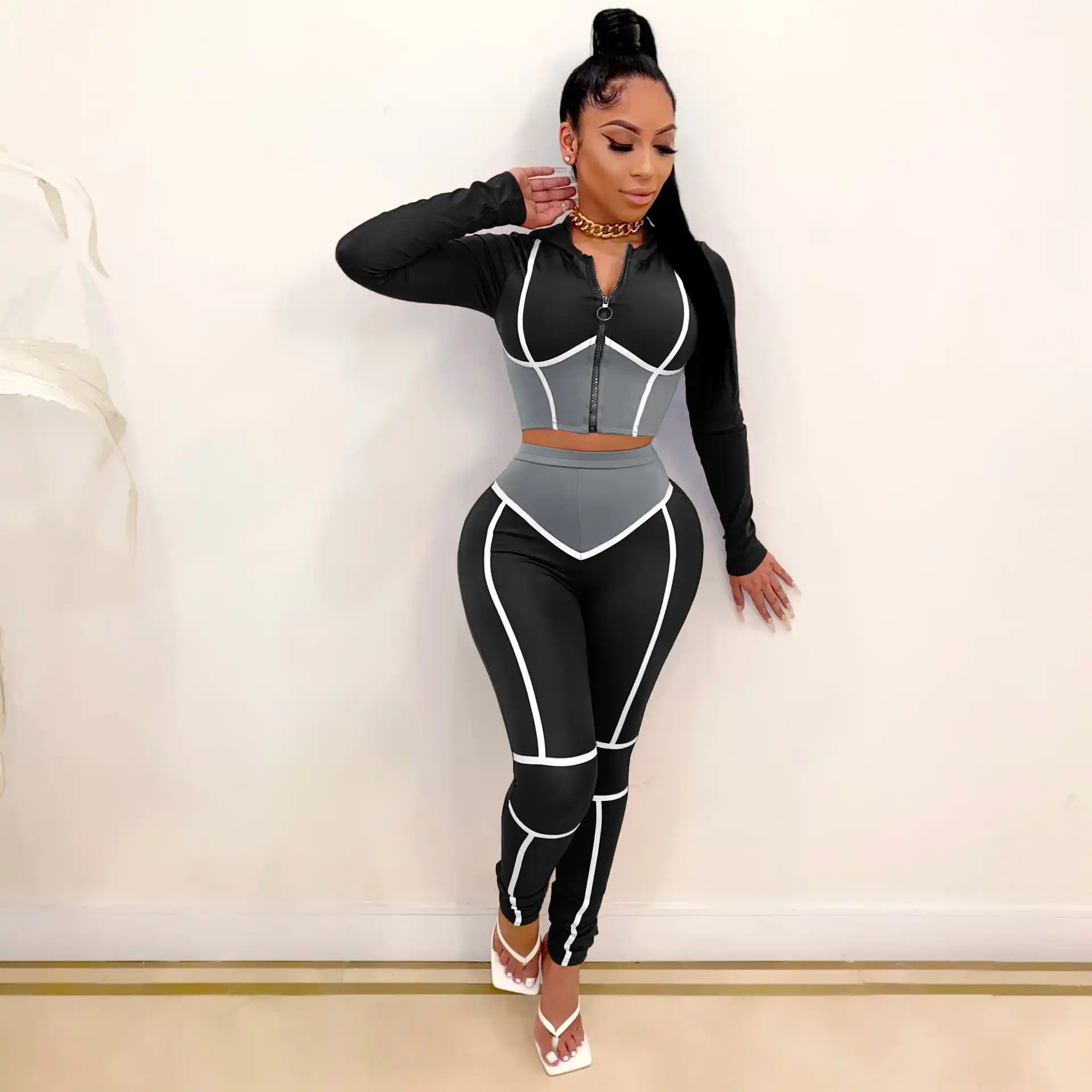 Side stance lifestyle photo of 2 piece workout suit, moisture-wicking tight fabric for global custom bulk manufacturing