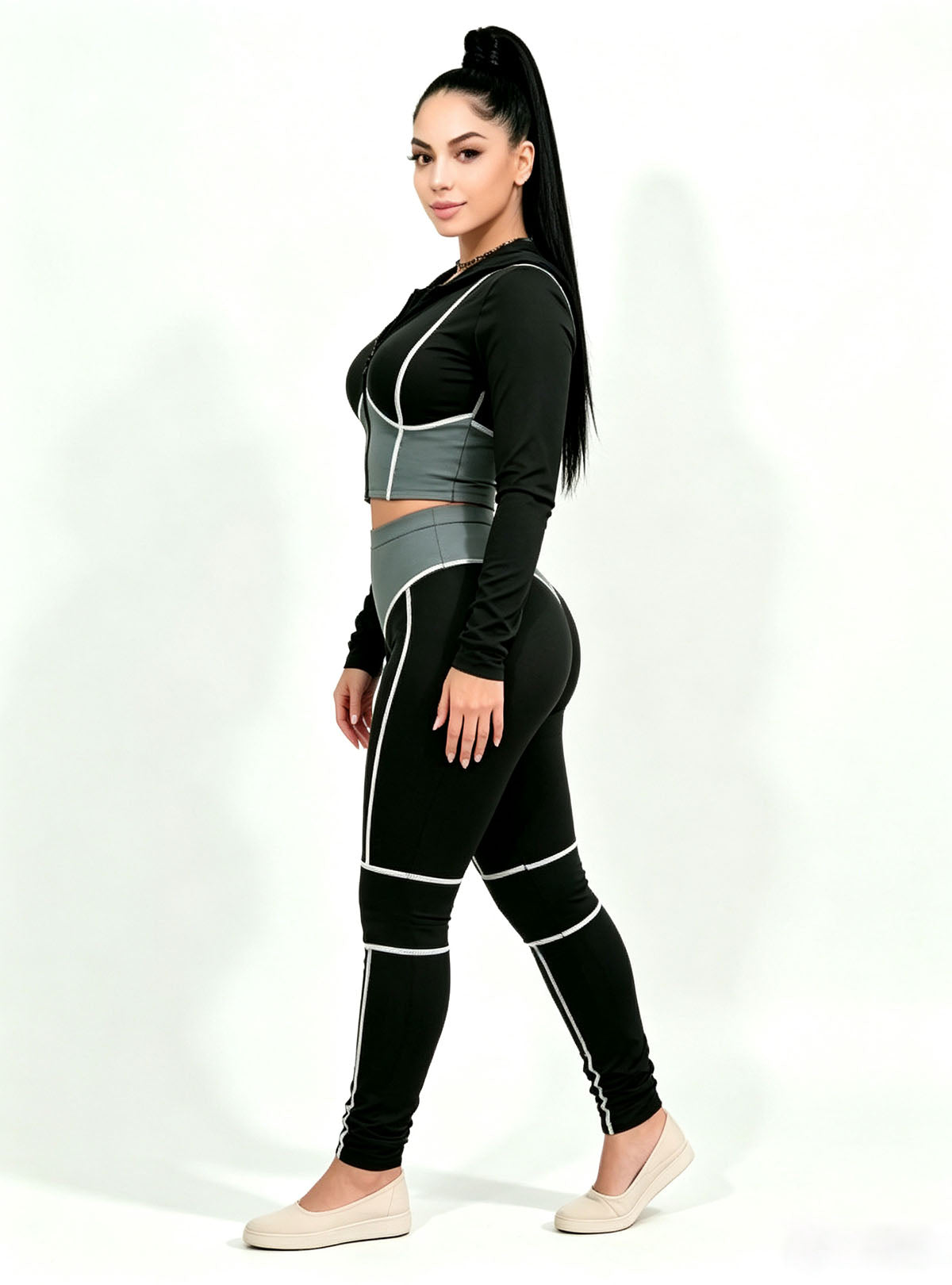 Haideyu women slim fit workout outfit side view, black gray long-sleeve gym set with leggings, custom-made women activewear, clean white studio shot