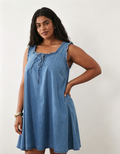 Hdfish Curve Denim Frill Detail Mini Dress, front view with hands in pockets, soft light-wash denim, plus-size casual swing dress, OEM/ODM custom, 50 MOQ, contact Hdfish88@outlook.com
