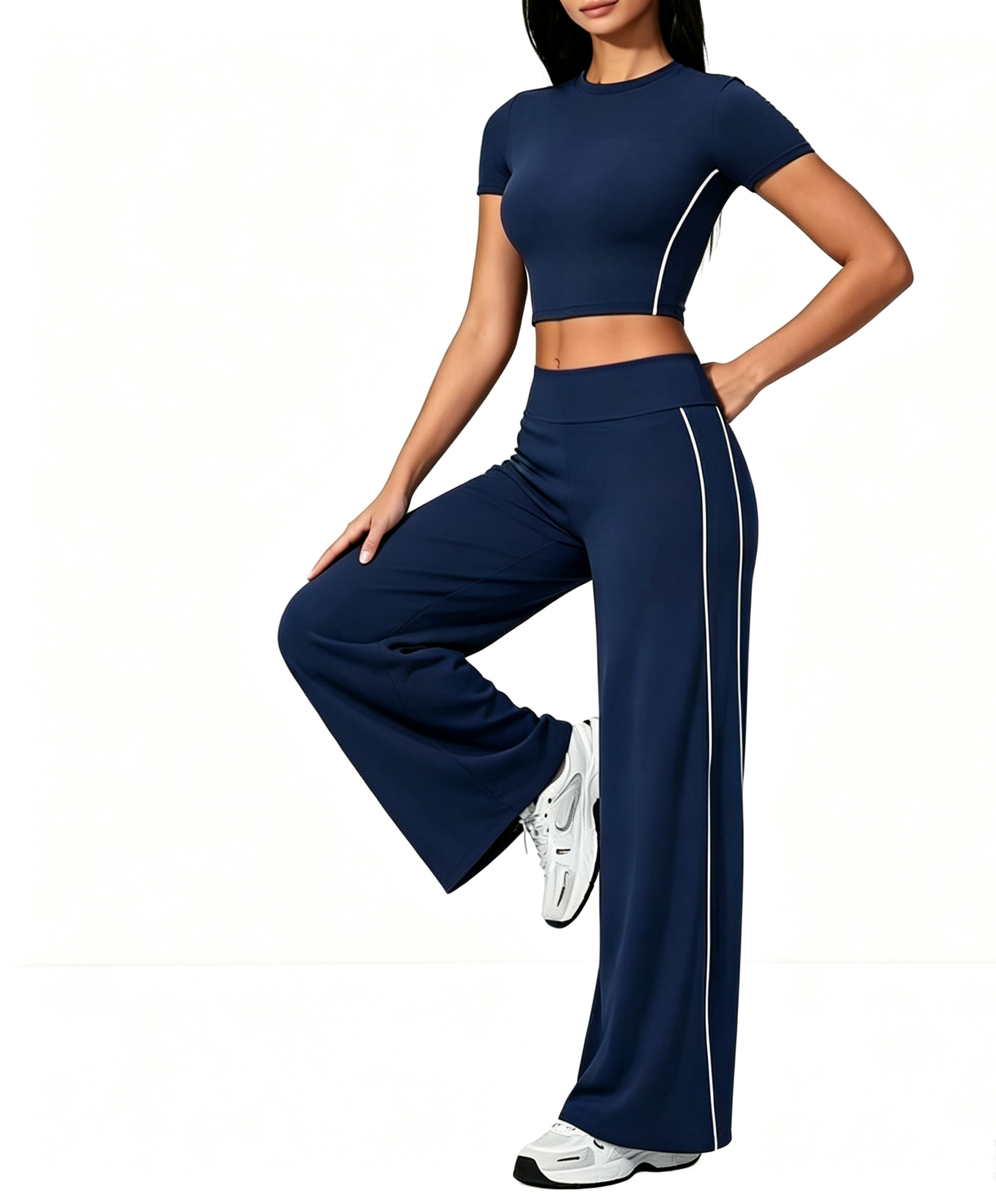 Custom Haideyu OEM ODM navy blue side striped yoga 2 piece set, nude soft stretch cropped short sleeve top, high waist wide flare leg pants, female model single leg rest pose plain white background pilates apparel