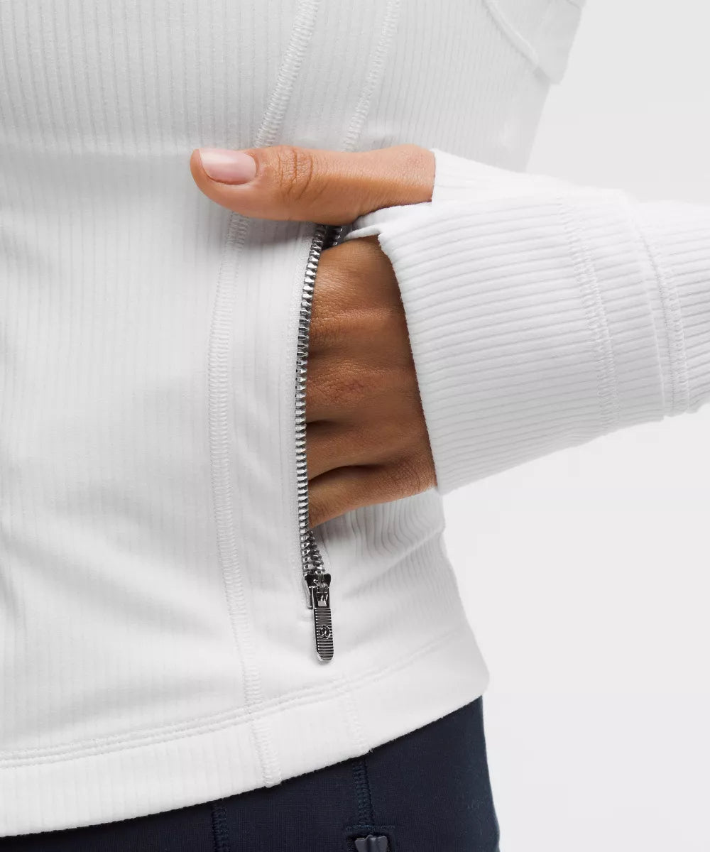 Close-up of metal zipper and thumb hole cuff on Haideyu ribbed cropped custom yoga jacket