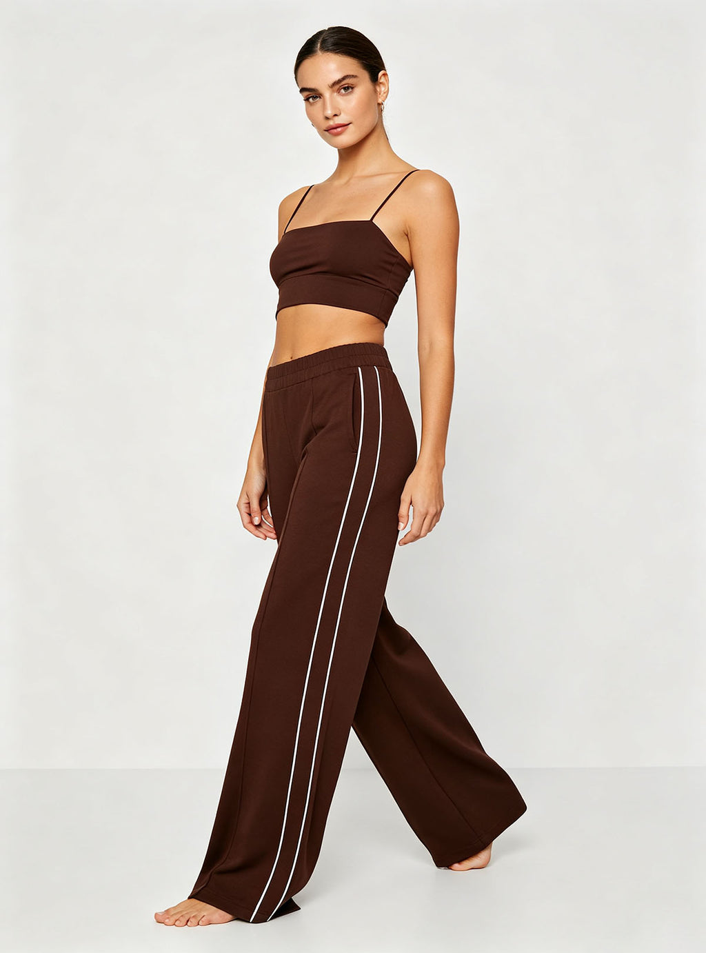 Side profile full shot Haideyu personalized brown side stripe flare sports pants elastic hidden waist loose stretch casual custom women apparel