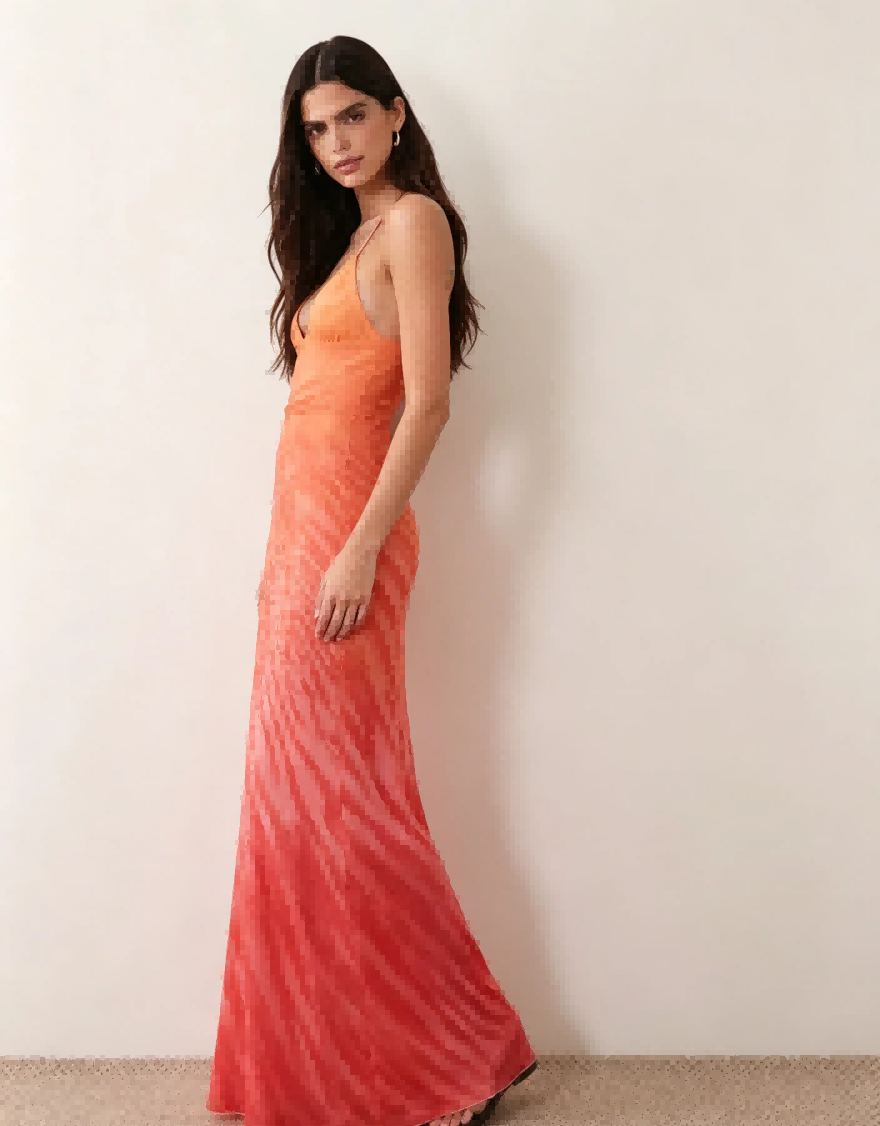 Side profile shot of Haideyu personalized orange ombre mermaid gown thin spaghetti straps flared fishtail hem custom evening apparel