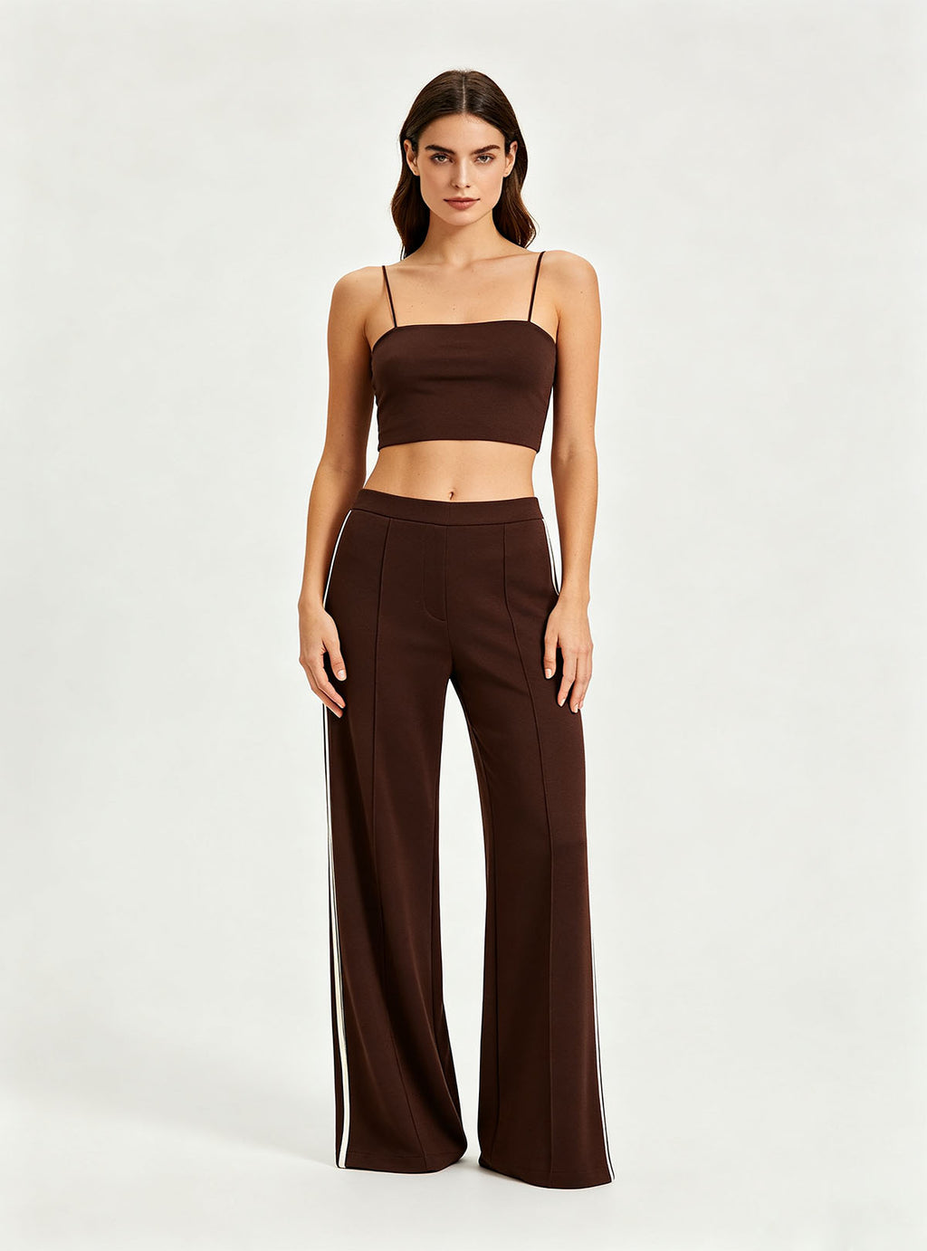 Straight full front view Haideyu private label brown knit flare pants vertical white side stripe floor length everyday custom sportswear