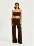 Straight full front view Haideyu private label brown knit flare pants vertical white side stripe floor length everyday custom sportswear