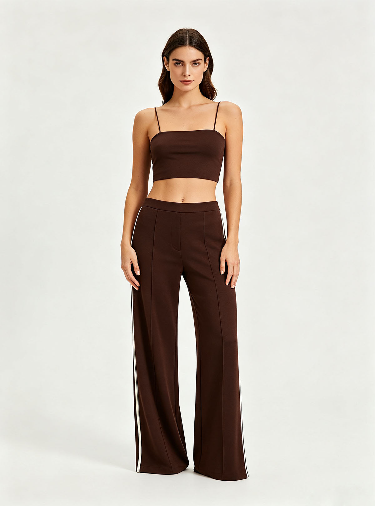 Straight full front view Haideyu private label brown knit flare pants vertical white side stripe floor length everyday custom sportswear