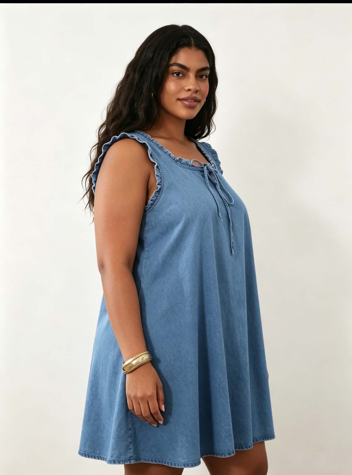 Side profile full shot Haideyu private label blue denim loose shift mini dress flowy A-line hem lightweight casual custom dress