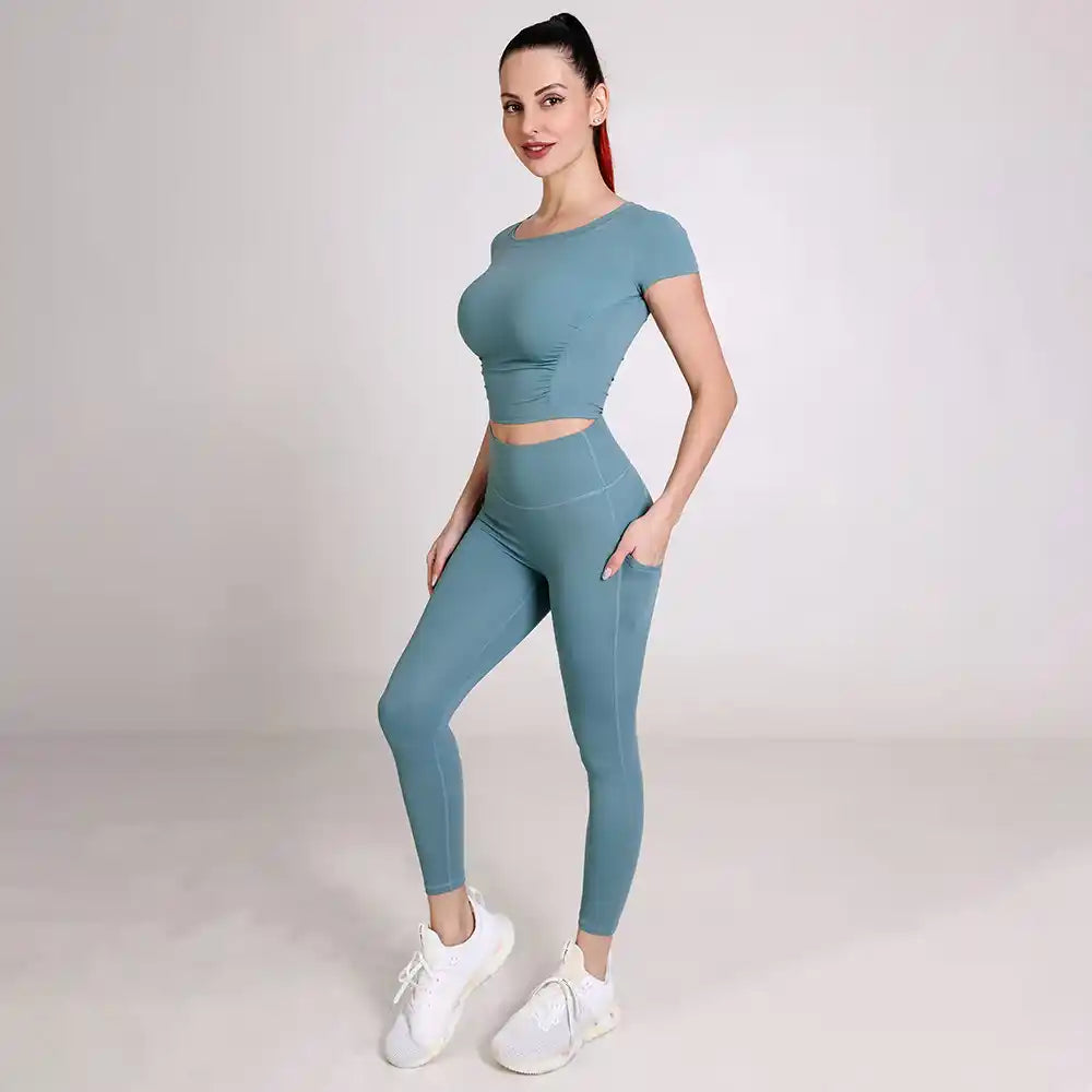 Haideyu women quick dry activewear set side view, short sleeve top and high waist pocket yoga pants private label custom apparel from haideyu.com
