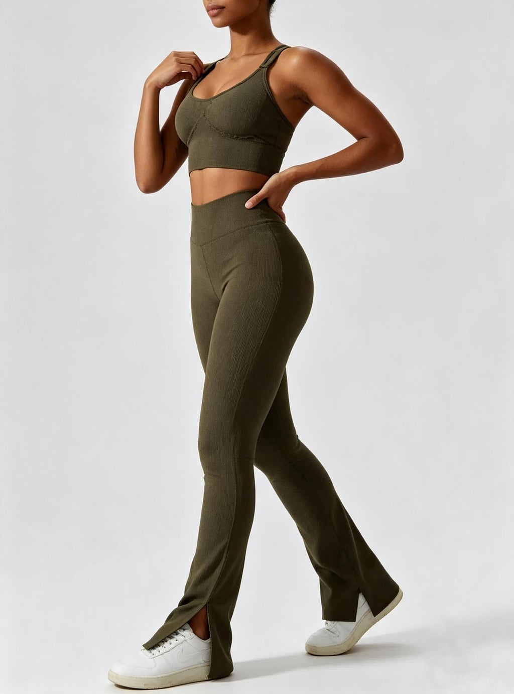 Haideyu women olive green two‑piece workout suit, adjustable strap sports bra and high‑waist split flare leggings, textured stretch fabric, OEM ODM custom sportswear service