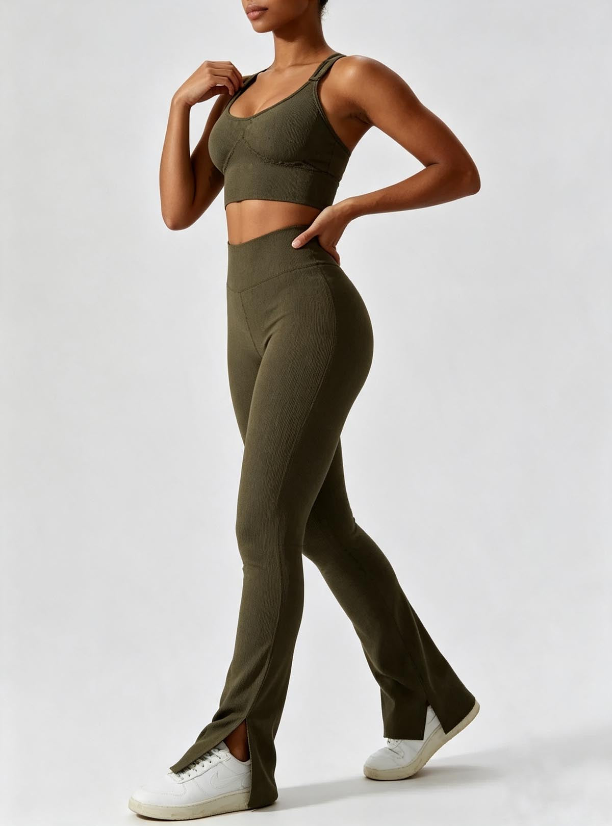 Haideyu women olive green two‑piece workout suit, adjustable strap sports bra and high‑waist split flare leggings, textured stretch fabric, OEM ODM custom sportswear service