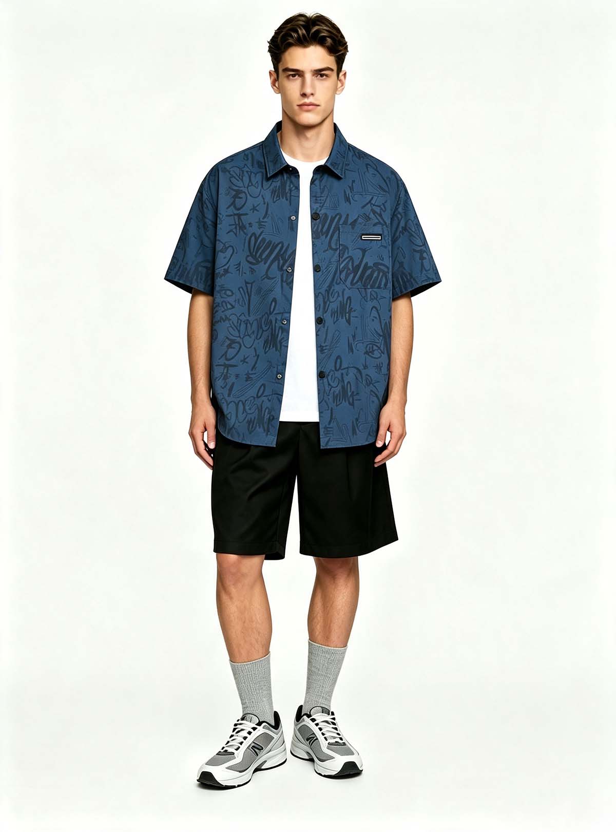 Haideyu men casual navy blue graffiti printed short sleeve shirt, relaxed button‑down top, handsome male‑model studio shot on solid white backdrop