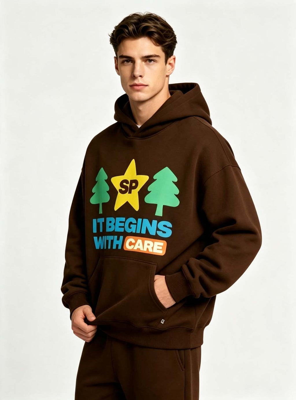 Haideyu relaxed fit brown graphic hoodie for men, creative letter tree star pattern, male model shot on solid white backdrop