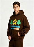 Haideyu relaxed fit brown graphic hoodie for men, creative letter tree star pattern, male model shot on solid white backdrop
