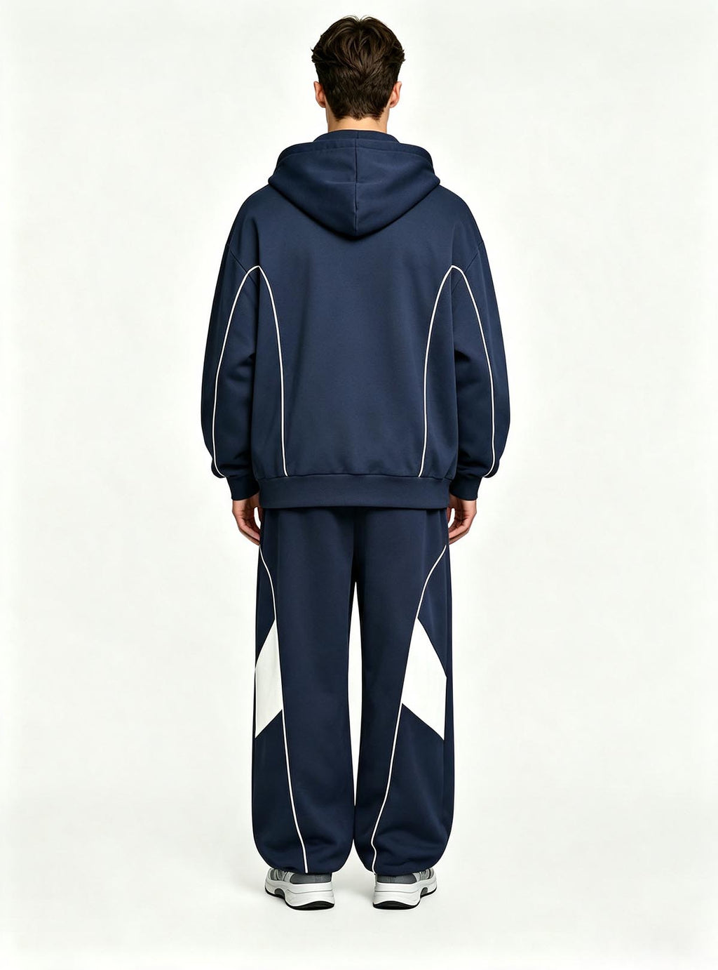 Haideyu relaxed fit men sport tracksuit, navy hooded jacket and wide‑leg pants with white geometric panel, male‑model back‑view studio shot plain white backdrop